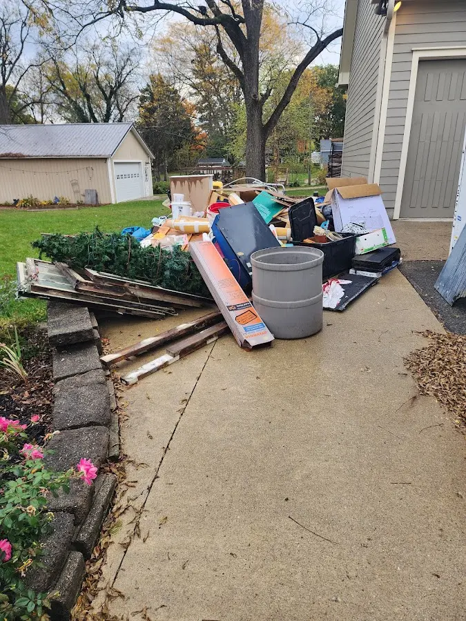 Dumpster being loaded with debris for 10 Yard Dumpster Rental in Holtville